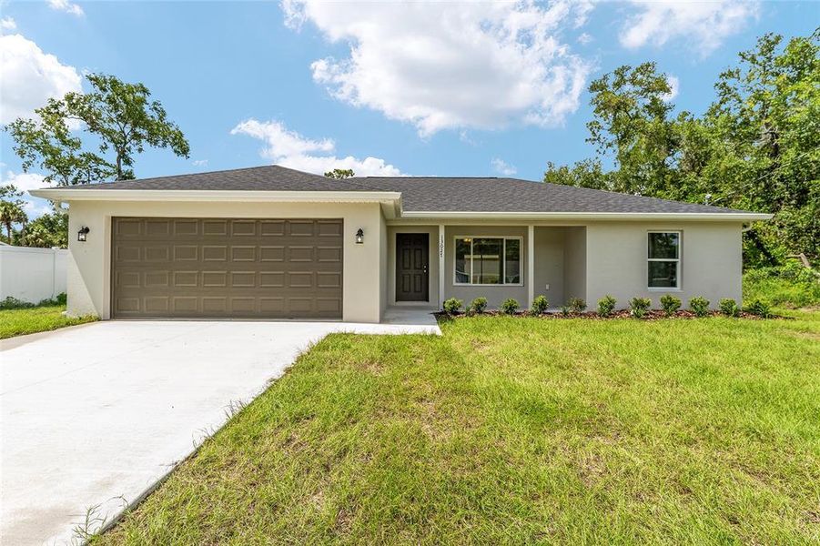 Front exterior of a new home in , Silver Springs, FL, highlighting curb appeal (Image 20).