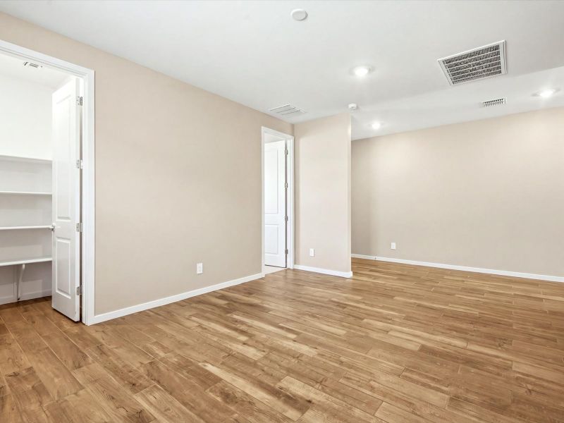 Spacious, unfurnished interior of a new home in White Tank Foothills Signature Series, Waddell (Image 15).
