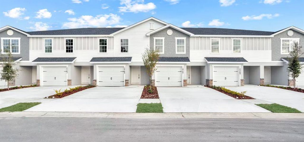 Front exterior of a new home in Terrace at Walden Lake, Plant City, FL, highlighting curb appeal (Image 1). Front exterior of a new home in Terrace at Walden Lake, Plant City, FL, highlighting curb appeal (Image 1).