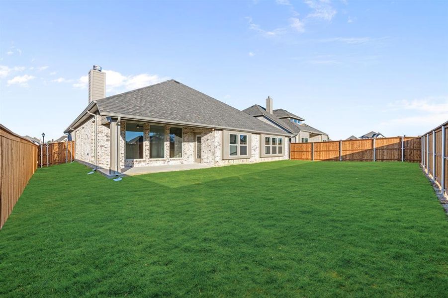 Exterior details and patio area of a home in Mockingbird Hills 60-65, Joshua (Image 3).