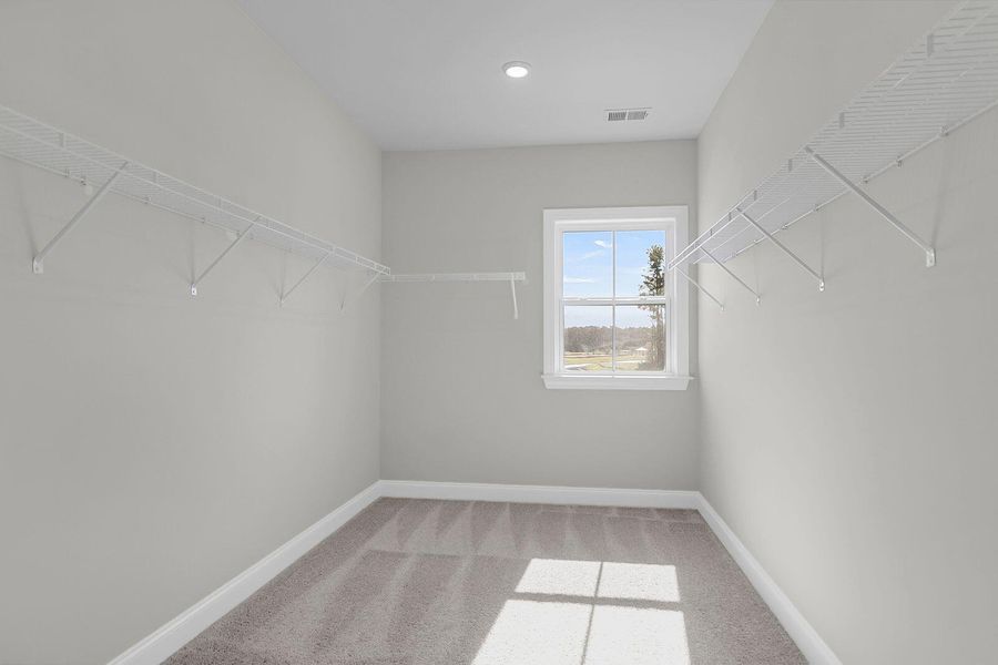 Spacious, unfurnished interior of a new home in Tidewater at Lakes of Cane Bay, Summerville (Image 28).