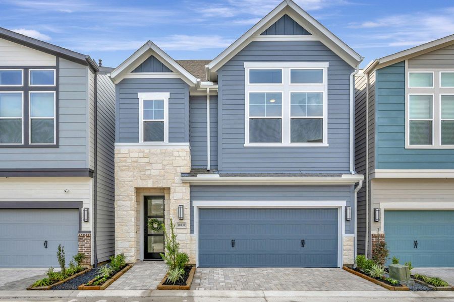 Representative exterior photo of a completed home built from the The Bellomy by David Weekley Homes in Retreat at Oak Park, Houston, TX (Image 18). Representative exterior photo of a completed home built from the The Bellomy by David Weekley Homes in Retreat at Oak Park, Houston, TX (Image 18).