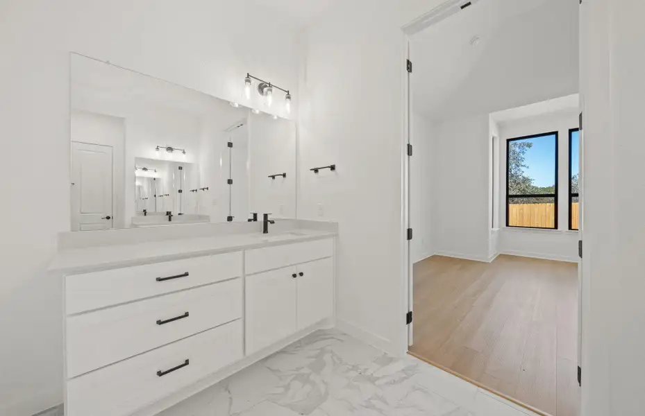 Furnished interior view inside a new home in 6 Creeks, Kyle (Image 8).