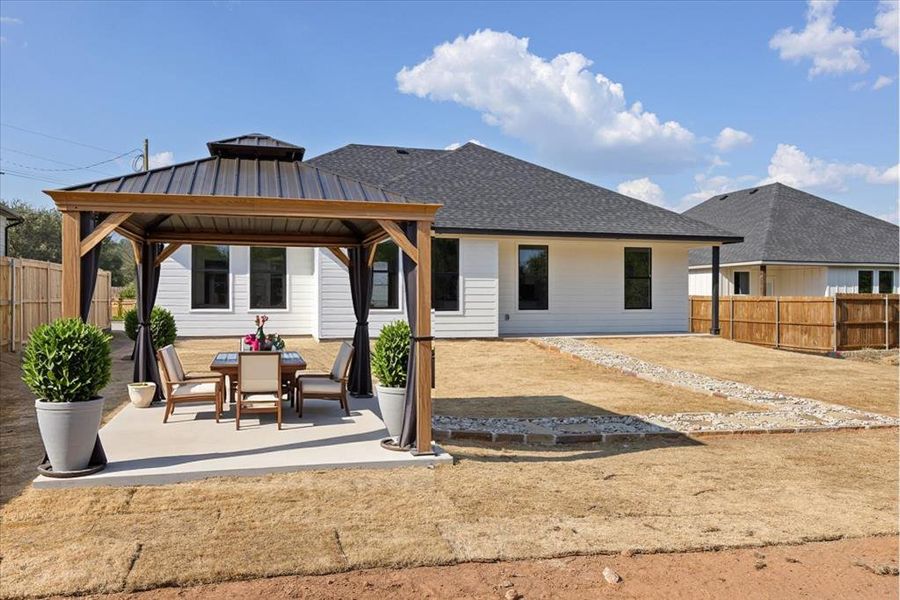 Front exterior of a new home in , Granbury, TX, highlighting curb appeal (Image 2). Front exterior of a new home in , Granbury, TX, highlighting curb appeal (Image 2).