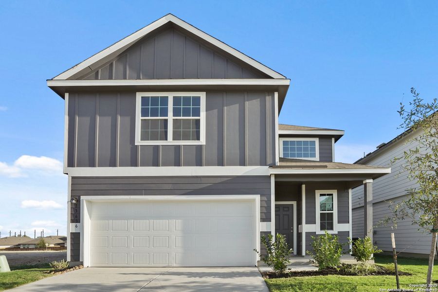 Front exterior of a new home in Abbott Place, St. Hedwig, TX, highlighting curb appeal (Image 1).
