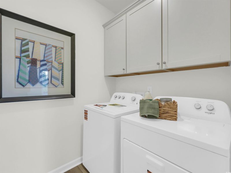 Laundry area featuring cabinet space and washing machine and clothes dryer