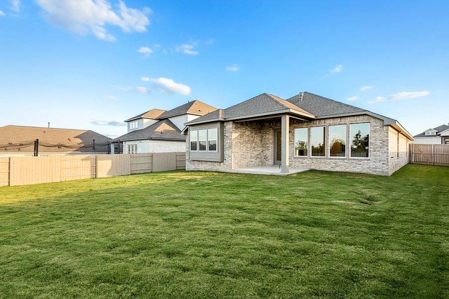 Exterior details and patio area of a home in The Colony, Bastrop (Image 4).
