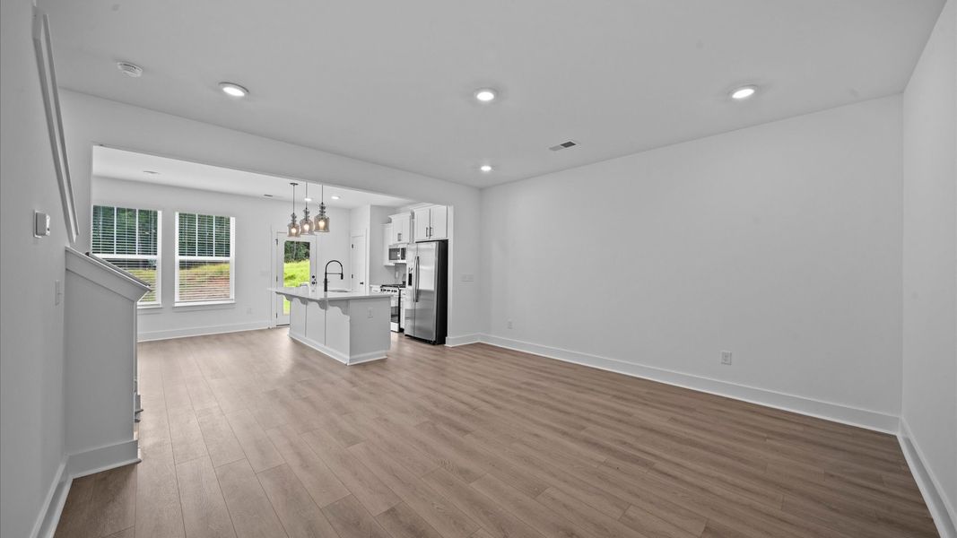 First-rate living space with tasteful hardwood floors and a functional open-concept design
