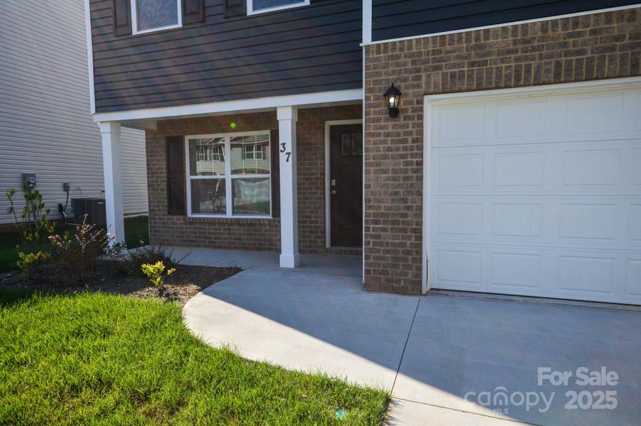Exterior details and patio area of a home in Wildbrook Village, Waynesville (Image 3).