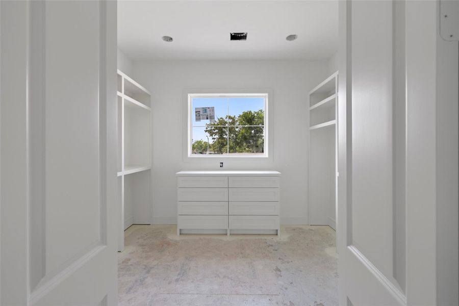 Closet off the primary suite, again, tons of natural light coming into the space. Closet off the primary suite, again, tons of natural light coming into the space.