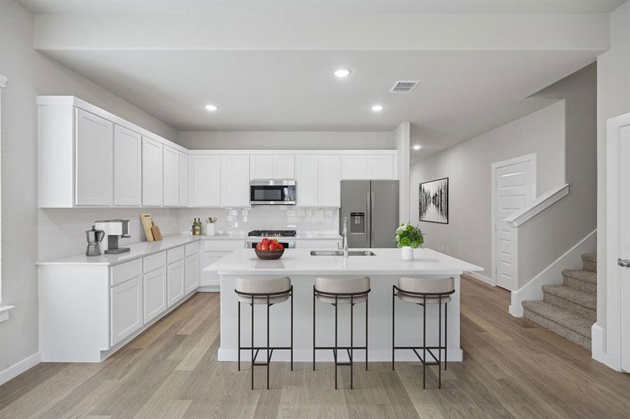 Kitchen in the Stanley II home plan by Trophy Signature Homes – REPRESENTATIVE PHOTO
