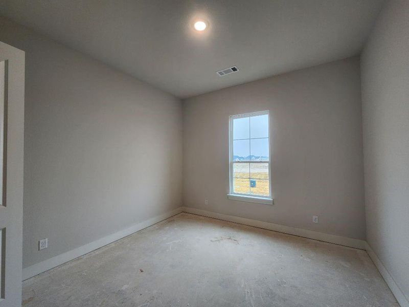 Empty room featuring baseboards and recessed lighting