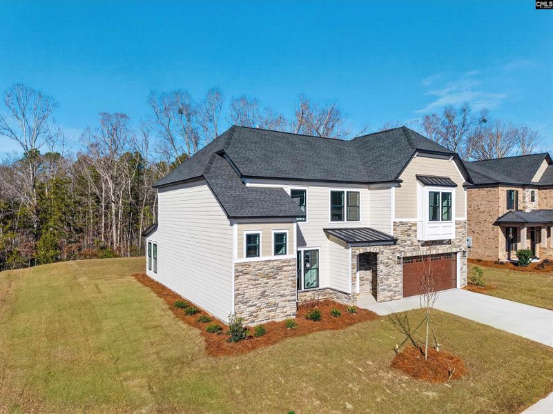Front exterior of a new home in Collins Cove, Chapin, SC, highlighting curb appeal (Image 25).