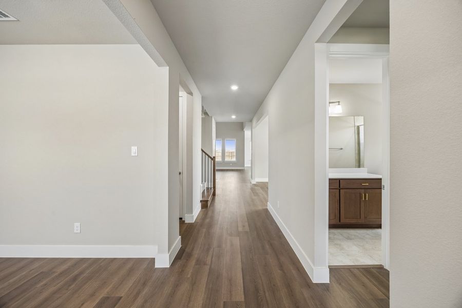 Representative unfurnished interior of a home built from the The Mockingbird by Lillian Custom Homes in Polo Ridge, Forney (Image 17).