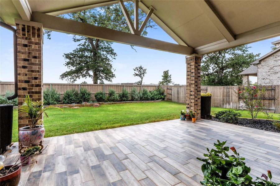 Fenced backyard featuring a patio Fenced backyard featuring a patio