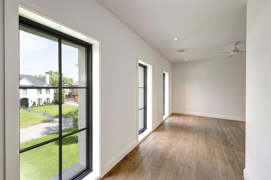 Third bedroom with ensuite bath and walk-in closet has fantastic windows and natural light.