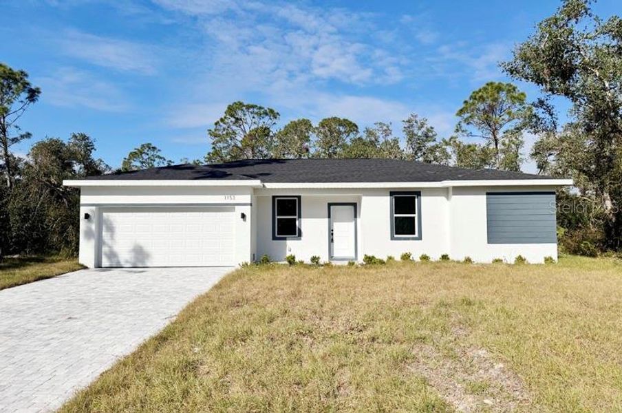 Front exterior of a new home in , Port Charlotte, FL, highlighting curb appeal (Image 18). Front exterior of a new home in , Port Charlotte, FL, highlighting curb appeal (Image 18).