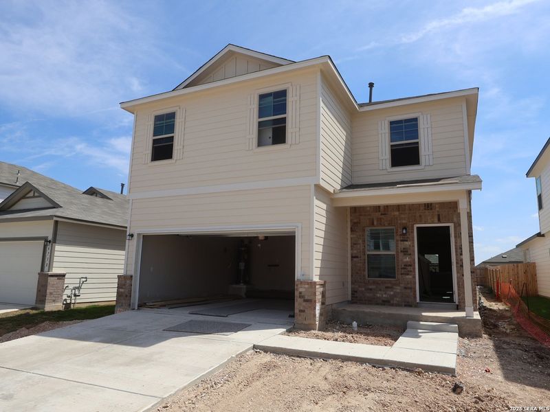 Front exterior of a new home in Winding Brook, San Antonio, TX, highlighting curb appeal (Image 16). Front exterior of a new home in Winding Brook, San Antonio, TX, highlighting curb appeal (Image 16).