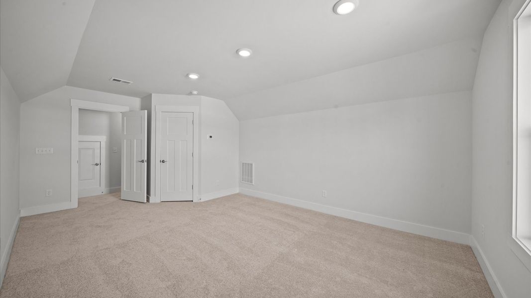 First-class bedroom with generous proportions, a walk-in closet, and beautiful natural light through large windows