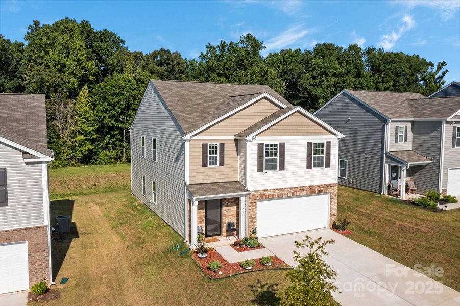 Front exterior of a new home in Mills at Long Creek, Dallas, NC, highlighting curb appeal (Image 23).