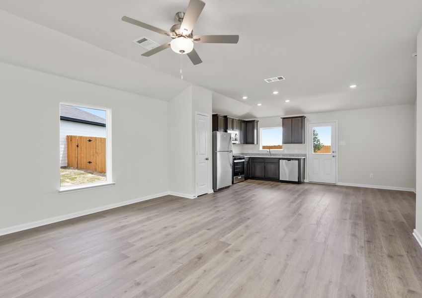 The living room has a large window that lets in great, natural light.