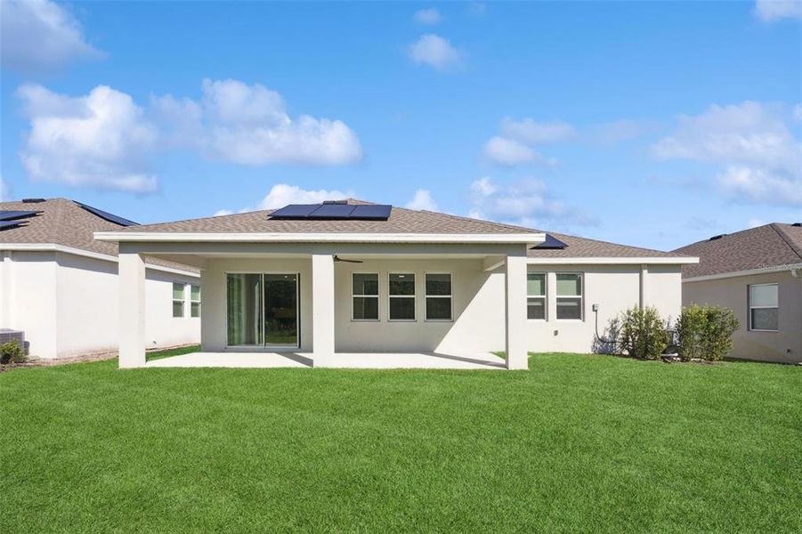 Exterior details and patio area of a home in Pine Glen: Chateau Collection, St. Cloud (Image 18).