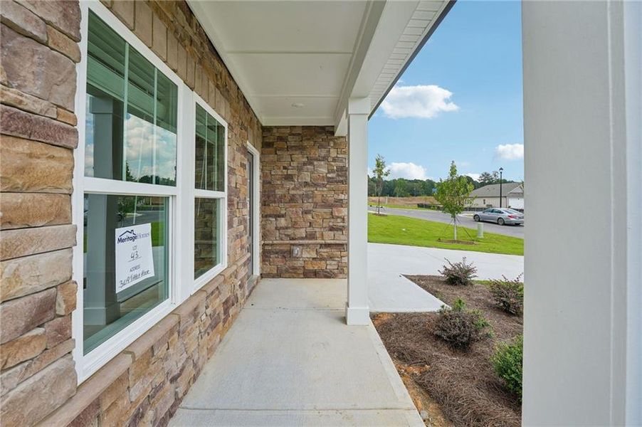 Exterior details and patio area of a home in Northwoods at Mirror Lake, Villa Rica (Image 30).