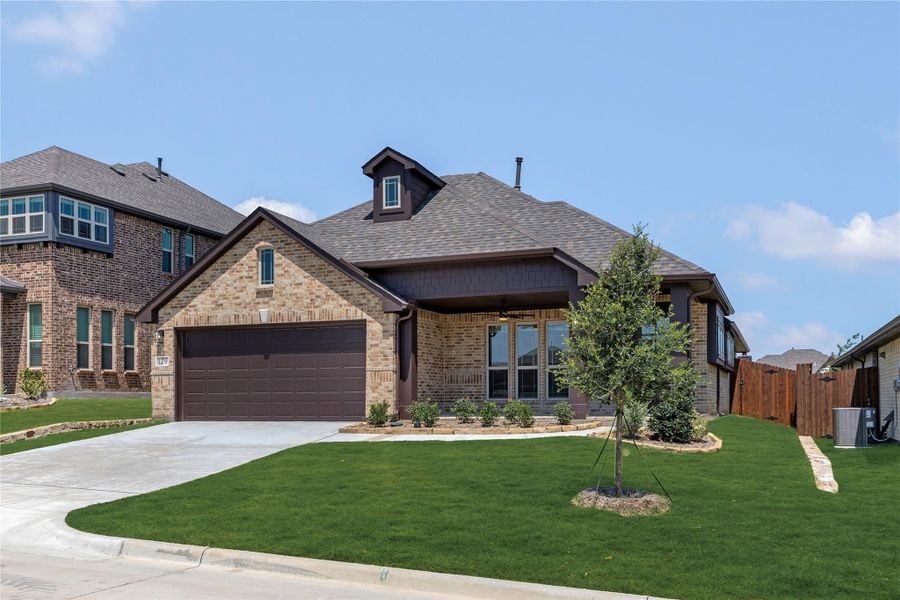 Single-story brick home with two-car garage, covered porch, and manicured front lawn Single-story brick home with two-car garage, covered porch, and manicured front lawn