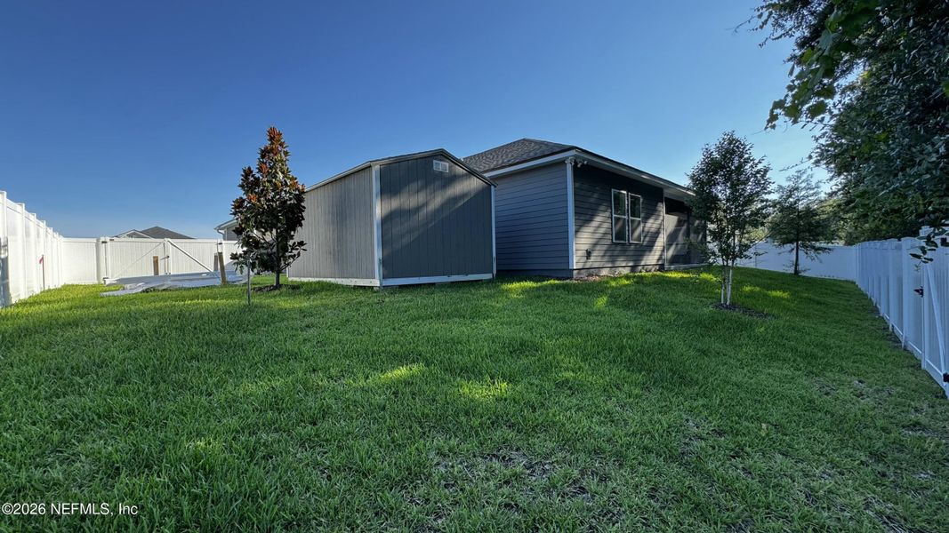 Exterior details and patio area of a home in McGirt's Creek, Yulee (Image 12).