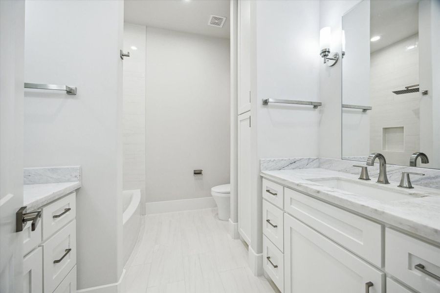 Third Bath – Located on the third floor with access from both a bedroom and the hallway. Features double vanities and a shower/tub combination. Third Bath – Located on the third floor with access from both a bedroom and the hallway. Features double vanities and a shower/tub combination.