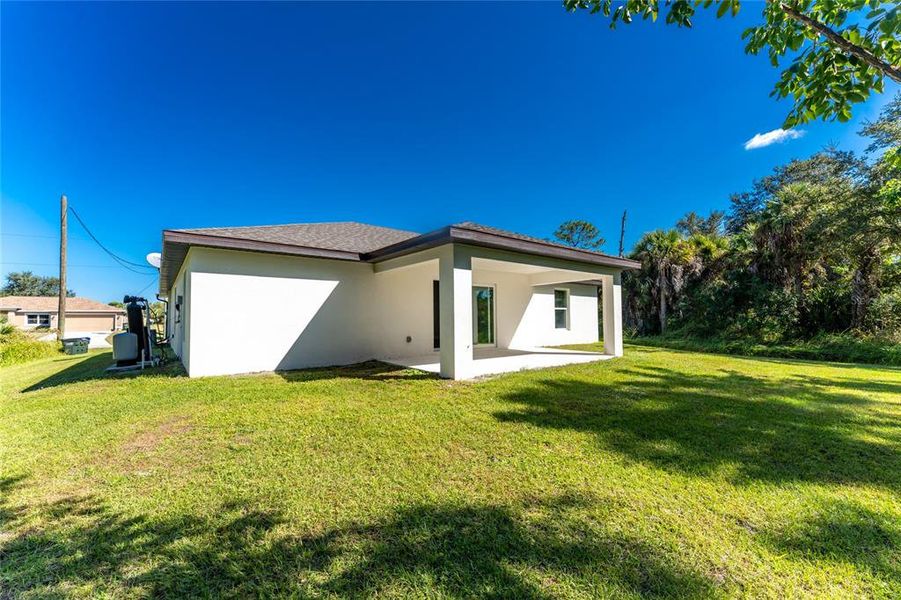 Exterior details and patio area of a home in , North Port (Image 32).