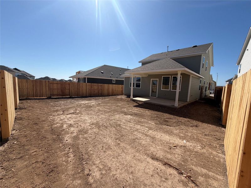 Exterior details and patio area of a home in Lariat, Liberty Hill (Image 13).