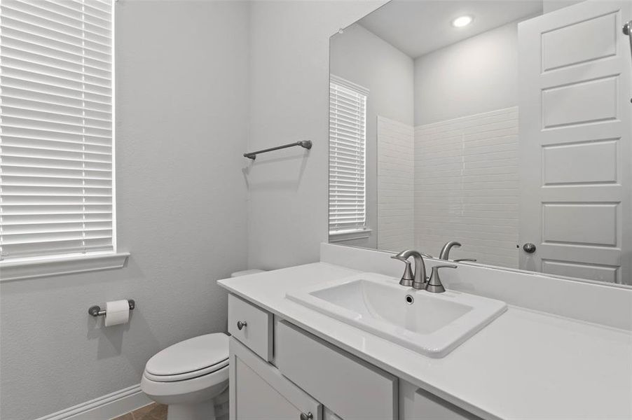 Bathroom featuring toilet and vanity