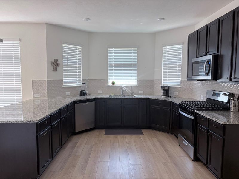 Furnished interior view inside a new home in Sunterra, Katy (Image 4).
