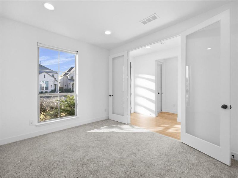 Carpeted Office with recessed lighting and french doors Carpeted Office with recessed lighting and french doors