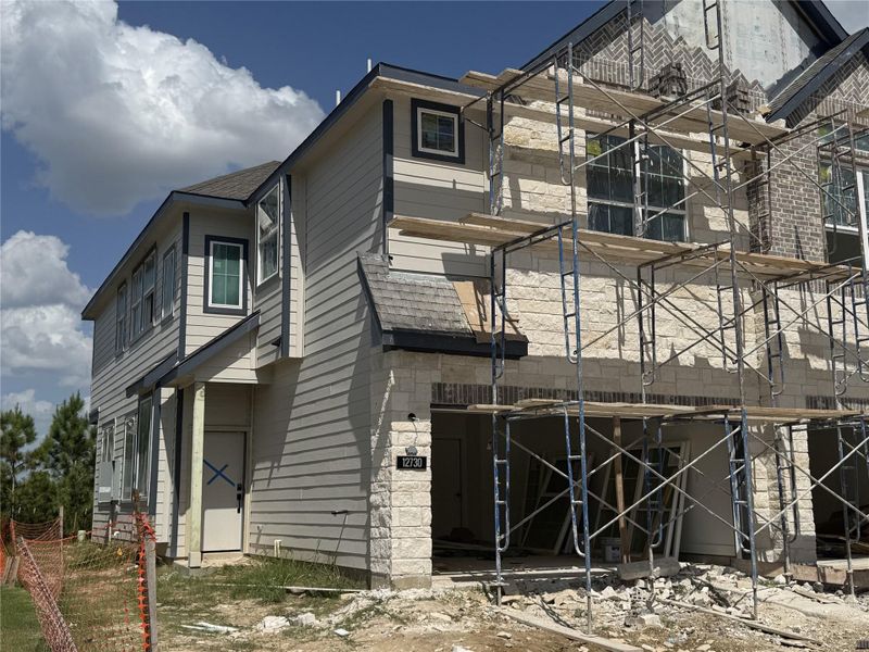 Front exterior of a new home in Bridgeland, Cypress, TX, highlighting curb appeal (Image 16).