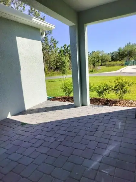 Exterior details and patio area of a home in Loch Leven Park, Mount Dora (Image 3).