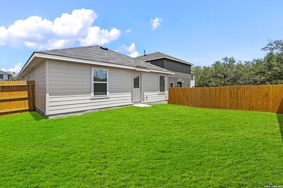 Exterior details and patio area of a home in Hickory Ridge, Elmendorf (Image 3).