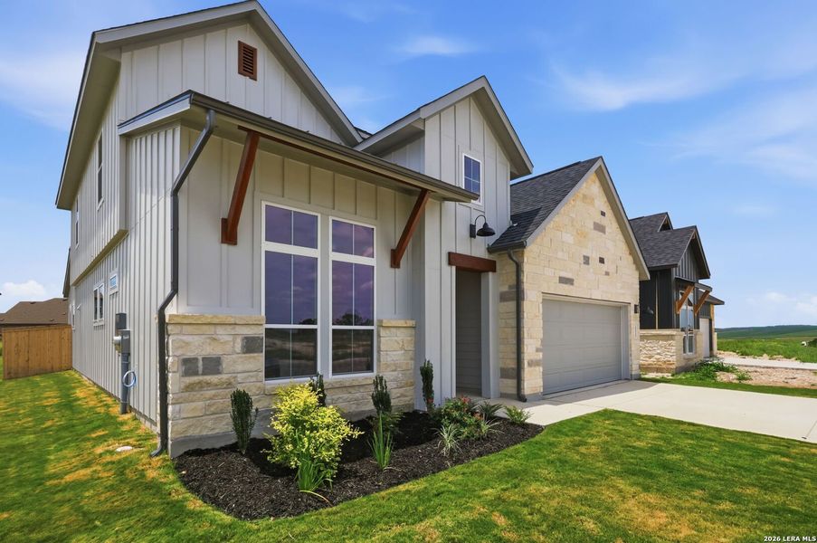 Front exterior of a new home in Megan's Landing, Castroville, TX, highlighting curb appeal (Image 1). Front exterior of a new home in Megan's Landing, Castroville, TX, highlighting curb appeal (Image 1).