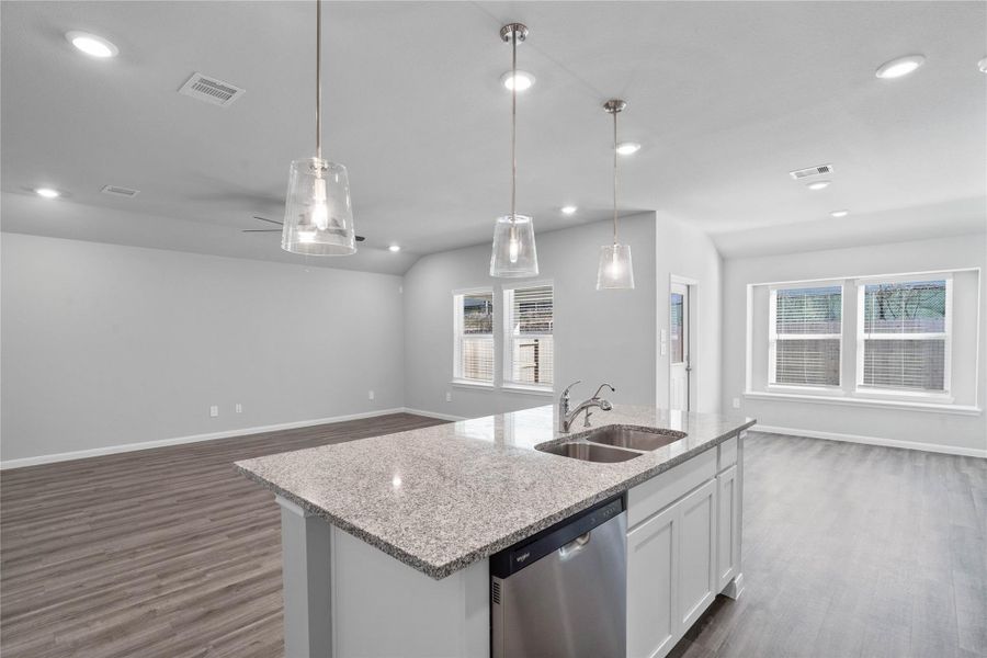 From the expansive kitchen island, enjoy seamless sightlines across the open-concept dining and living areas, making entertaining a breeze and ensuring you're never far from the conversation. From the expansive kitchen island, enjoy seamless sightlines across the open-concept dining and living areas, making entertaining a breeze and ensuring you're never far from the conversation.