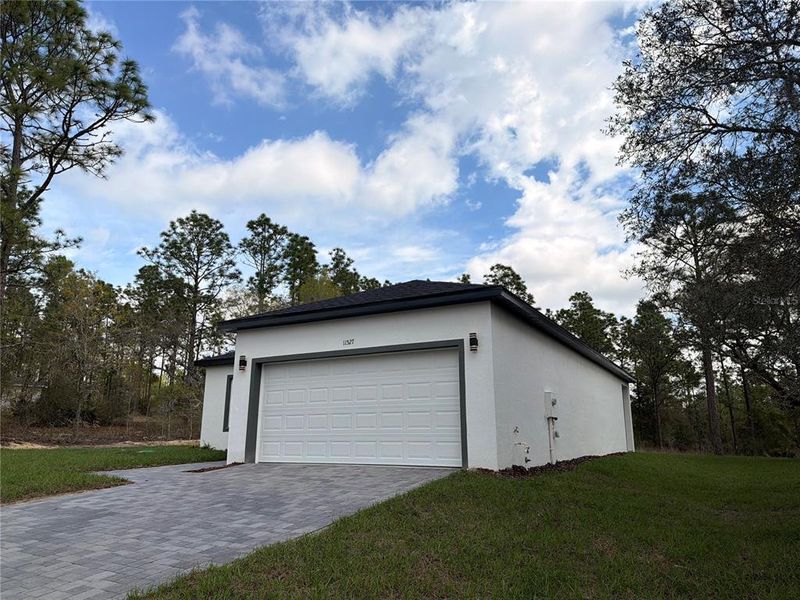 Front exterior of a new home in , Dunnellon, FL, highlighting curb appeal (Image 1). Front exterior of a new home in , Dunnellon, FL, highlighting curb appeal (Image 1).