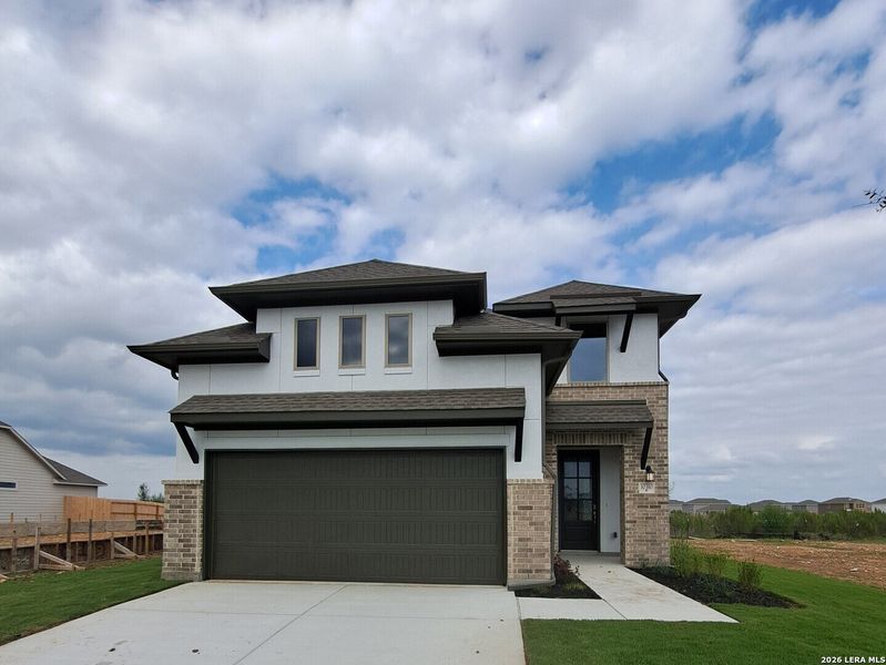 Front exterior of a new home in Rhine Valley, Schertz, TX, highlighting curb appeal (Image 15).