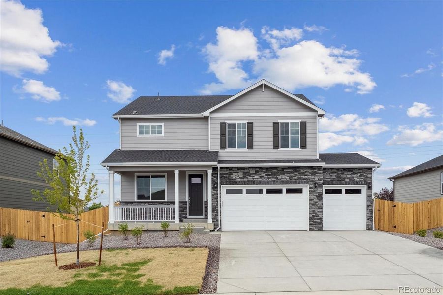 Front exterior of a new home in Timberleaf, Thornton, CO, highlighting curb appeal (Image 2).