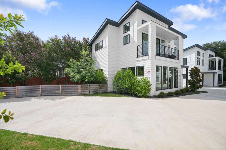 Modern architecture defines this dwelling, with clean lines and a private balcony overlooking the expansive driveway. Modern architecture defines this dwelling, with clean lines and a private balcony overlooking the expansive driveway.