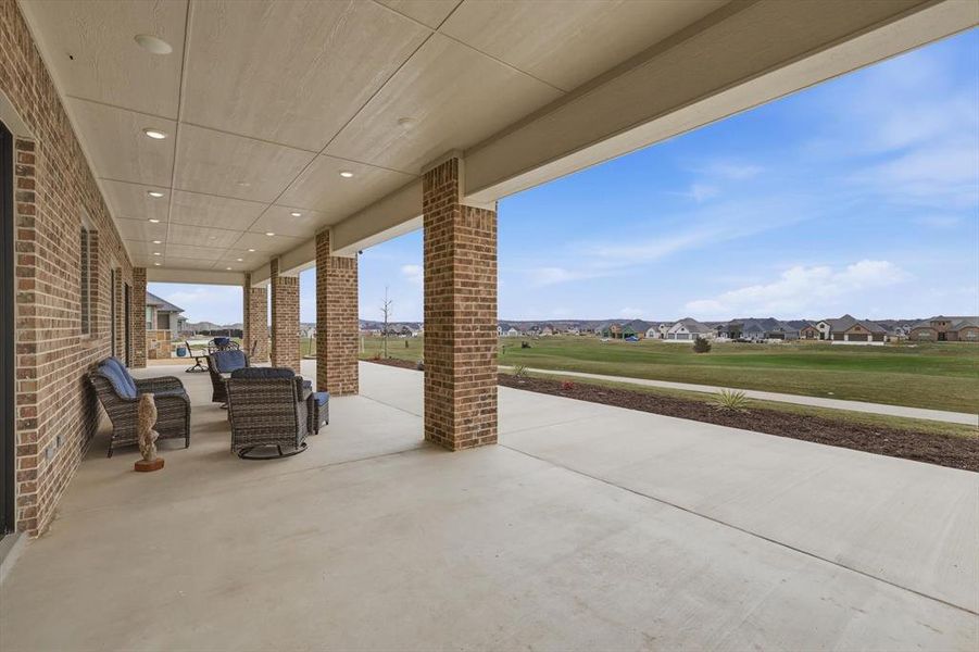 Spectacular Expanded Outdoor Living Pavilion with Prized Southern Exposure and commanding Panoramic Fairway Views from Tee to Green.