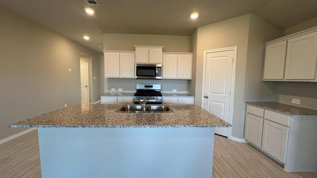 Kitchen -All Home and community information, including pricing, included features, terms, availability and amenities, are subject to change at any time without notice or obligation. All Drawings, pictures, photographs, video, square footages, floor plans, elevations, features, colors and sizes are approximate for illustration purposes only and will vary from the homes as built.