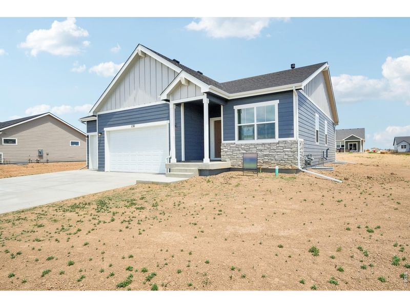 Front exterior of a new home in Hudson Hills, Hudson, CO, highlighting curb appeal (Image 20).