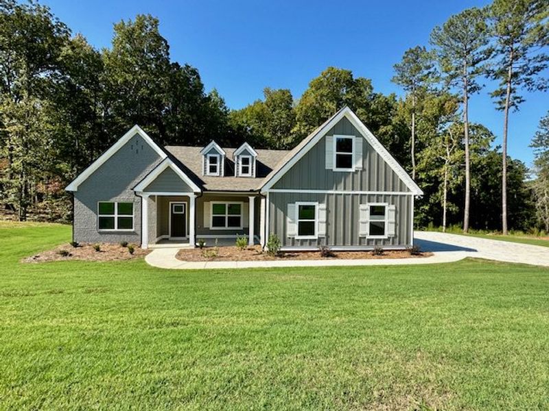 Front exterior of a new home in Deer Creek, Moreland, GA, highlighting curb appeal (Image 1). Front exterior of a new home in Deer Creek, Moreland, GA, highlighting curb appeal (Image 1).