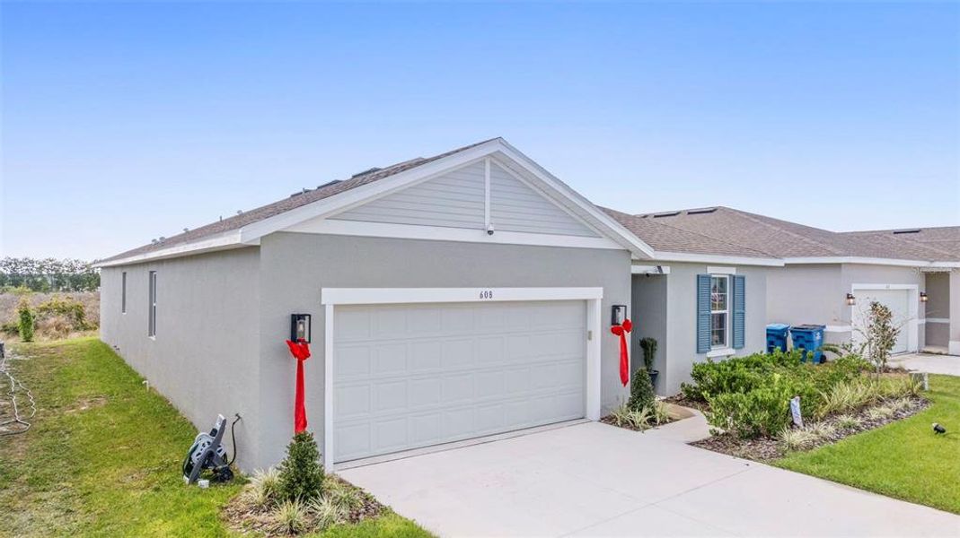 Front exterior of a new home in , Lake Wales, FL, highlighting curb appeal (Image 29). Front exterior of a new home in , Lake Wales, FL, highlighting curb appeal (Image 29).