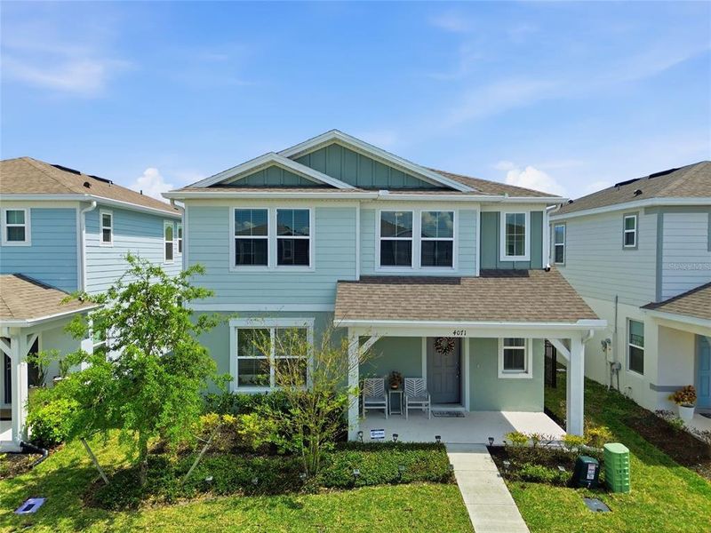 Front exterior of a new home in Winding Meadows, Apopka, FL, highlighting curb appeal (Image 23).